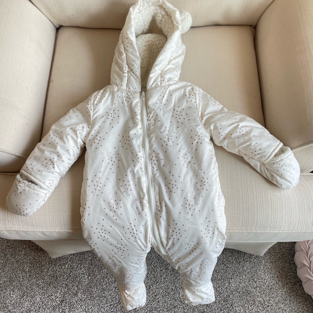 Ivory snowsuit with rose gold stars.  Non smoking home.